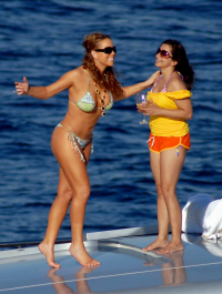 July 6, 2007: Mariah Carey shows off her newly toned bod, as she frolicked around Roberto Cavalli's yacht while on holiday in Salerno, Italy.  Carey played photographer as she took snaps of her friends on the front of the boat, then switched roles and posed for pictures of her own.  She then enjoyed a nice glass of wine before going swimming and jet skiing.
Credit: INFphoto.com  Ref: infit-03/rs