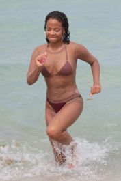 Miami, FL  - Christina Milian is on holiday in Miami. The singer puts her curves on display wearing a brown bikini paired with a long sleeve fishnet top. Christina cools off on a hot Summer day by taking a dip in the water.  Pictured: Christina Milian  BACKGRID USA 22 JULY 2017  BYLINE MUST READ: FAMA / BACKGRID  USA: +1 310 798 9111 / usasales@backgrid.com  UK: +44 208 344 2007 / uksales@backgrid.com  *UK Clients - Pictures Containing Children
Please Pixelate Face Prior To Publication*