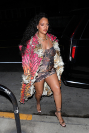 Santa Monica, CA  - *EXCLUSIVE*  - **WEB MUST CALL FOR PRICING** Rihanna flashes huge diamond on THAT finger as she heads to Giorgio Baldi for dinner! The superstar who is expecting her first child with boyfriend A$AP was seen  heading to dinner at  Giorgio Baldi restaurant  with friends in Santa Monica on Tuesday night. The 34-year-old singer is wearing a cat print skin-tight curvy dress, high heeled sandals  and a colorful fur-lined coat. What stood out the most was the huge rock on her left ring finger as she adjusted her necklace. The superstar as been seen wearing the sparkler before but has started now wearing it on the finger typically reserved for an engagement ring.  Pictured: Rihanna  BACKGRID USA 22 MARCH 2022  USA: +1 310 798 9111 / usasales@backgrid.com  UK: +44 208 344 2007 / uksales@backgrid.com  *UK Clients - Pictures Containing Children
Please Pixelate Face Prior To Publication*