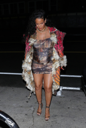 Santa Monica, CA  - *EXCLUSIVE*  - **WEB MUST CALL FOR PRICING** Rihanna flashes huge diamond on THAT finger as she heads to Giorgio Baldi for dinner! The superstar who is expecting her first child with boyfriend A$AP was seen  heading to dinner at  Giorgio Baldi restaurant  with friends in Santa Monica on Tuesday night. The 34-year-old singer is wearing a cat print skin-tight curvy dress, high heeled sandals  and a colorful fur-lined coat. What stood out the most was the huge rock on her left ring finger as she adjusted her necklace. The superstar as been seen wearing the sparkler before but has started now wearing it on the finger typically reserved for an engagement ring.  Pictured: Rihanna  BACKGRID USA 22 MARCH 2022  USA: +1 310 798 9111 / usasales@backgrid.com  UK: +44 208 344 2007 / uksales@backgrid.com  *UK Clients - Pictures Containing Children
Please Pixelate Face Prior To Publication*