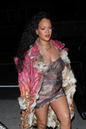 Santa Monica, CA  - *EXCLUSIVE*  - **WEB MUST CALL FOR PRICING** Rihanna flashes huge diamond on THAT finger as she heads to Giorgio Baldi for dinner! The superstar who is expecting her first child with boyfriend A$AP was seen  heading to dinner at  Giorgio Baldi restaurant  with friends in Santa Monica on Tuesday night. The 34-year-old singer is wearing a cat print skin-tight curvy dress, high heeled sandals  and a colorful fur-lined coat. What stood out the most was the huge rock on her left ring finger as she adjusted her necklace. The superstar as been seen wearing the sparkler before but has started now wearing it on the finger typically reserved for an engagement ring.  Pictured: Rihanna  BACKGRID USA 22 MARCH 2022  USA: +1 310 798 9111 / usasales@backgrid.com  UK: +44 208 344 2007 / uksales@backgrid.com  *UK Clients - Pictures Containing Children
Please Pixelate Face Prior To Publication*