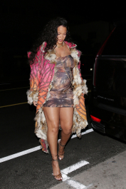 Santa Monica, CA  - *EXCLUSIVE*  - **WEB MUST CALL FOR PRICING** Rihanna flashes huge diamond on THAT finger as she heads to Giorgio Baldi for dinner! The superstar who is expecting her first child with boyfriend A$AP was seen  heading to dinner at  Giorgio Baldi restaurant  with friends in Santa Monica on Tuesday night. The 34-year-old singer is wearing a cat print skin-tight curvy dress, high heeled sandals  and a colorful fur-lined coat. What stood out the most was the huge rock on her left ring finger as she adjusted her necklace. The superstar as been seen wearing the sparkler before but has started now wearing it on the finger typically reserved for an engagement ring.  Pictured: Rihanna  BACKGRID USA 22 MARCH 2022  USA: +1 310 798 9111 / usasales@backgrid.com  UK: +44 208 344 2007 / uksales@backgrid.com  *UK Clients - Pictures Containing Children
Please Pixelate Face Prior To Publication*