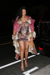 Santa Monica, CA  - *EXCLUSIVE*  - **WEB MUST CALL FOR PRICING** Rihanna flashes huge diamond on THAT finger as she heads to Giorgio Baldi for dinner! The superstar who is expecting her first child with boyfriend A$AP was seen  heading to dinner at  Giorgio Baldi restaurant  with friends in Santa Monica on Tuesday night. The 34-year-old singer is wearing a cat print skin-tight curvy dress, high heeled sandals  and a colorful fur-lined coat. What stood out the most was the huge rock on her left ring finger as she adjusted her necklace. The superstar as been seen wearing the sparkler before but has started now wearing it on the finger typically reserved for an engagement ring.  Pictured: Rihanna  BACKGRID USA 22 MARCH 2022  USA: +1 310 798 9111 / usasales@backgrid.com  UK: +44 208 344 2007 / uksales@backgrid.com  *UK Clients - Pictures Containing Children
Please Pixelate Face Prior To Publication*