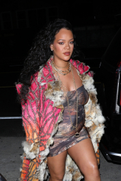 Santa Monica, CA  - *EXCLUSIVE*  - **WEB MUST CALL FOR PRICING** Rihanna flashes huge diamond on THAT finger as she heads to Giorgio Baldi for dinner! The superstar who is expecting her first child with boyfriend A$AP was seen  heading to dinner at  Giorgio Baldi restaurant  with friends in Santa Monica on Tuesday night. The 34-year-old singer is wearing a cat print skin-tight curvy dress, high heeled sandals  and a colorful fur-lined coat. What stood out the most was the huge rock on her left ring finger as she adjusted her necklace. The superstar as been seen wearing the sparkler before but has started now wearing it on the finger typically reserved for an engagement ring. Shot on 03/22/22.  Pictured: Rihanna  BACKGRID USA 23 MARCH 2022  USA: +1 310 798 9111 / usasales@backgrid.com  UK: +44 208 344 2007 / uksales@backgrid.com  *UK Clients - Pictures Containing Children
Please Pixelate Face Prior To Publication*