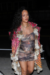 Santa Monica, CA  - *EXCLUSIVE*  - **WEB MUST CALL FOR PRICING** Rihanna flashes huge diamond on THAT finger as she heads to Giorgio Baldi for dinner! The superstar who is expecting her first child with boyfriend A$AP was seen  heading to dinner at  Giorgio Baldi restaurant  with friends in Santa Monica on Tuesday night. The 34-year-old singer is wearing a cat print skin-tight curvy dress, high heeled sandals  and a colorful fur-lined coat. What stood out the most was the huge rock on her left ring finger as she adjusted her necklace. The superstar as been seen wearing the sparkler before but has started now wearing it on the finger typically reserved for an engagement ring. Shot on 03/22/22.  Pictured: Rihanna  BACKGRID USA 23 MARCH 2022  USA: +1 310 798 9111 / usasales@backgrid.com  UK: +44 208 344 2007 / uksales@backgrid.com  *UK Clients - Pictures Containing Children
Please Pixelate Face Prior To Publication*