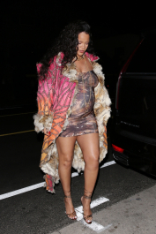 Santa Monica, CA  - *EXCLUSIVE*  - **WEB MUST CALL FOR PRICING** Rihanna flashes huge diamond on THAT finger as she heads to Giorgio Baldi for dinner! The superstar who is expecting her first child with boyfriend A$AP was seen  heading to dinner at  Giorgio Baldi restaurant  with friends in Santa Monica on Tuesday night. The 34-year-old singer is wearing a cat print skin-tight curvy dress, high heeled sandals  and a colorful fur-lined coat. What stood out the most was the huge rock on her left ring finger as she adjusted her necklace. The superstar as been seen wearing the sparkler before but has started now wearing it on the finger typically reserved for an engagement ring. Shot on 03/22/22.  Pictured: Rihanna  BACKGRID USA 23 MARCH 2022  USA: +1 310 798 9111 / usasales@backgrid.com  UK: +44 208 344 2007 / uksales@backgrid.com  *UK Clients - Pictures Containing Children
Please Pixelate Face Prior To Publication*