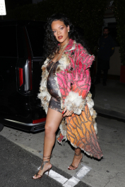 Santa Monica, CA  - *EXCLUSIVE*  - **WEB MUST CALL FOR PRICING** Rihanna flashes huge diamond on THAT finger as she heads to Giorgio Baldi for dinner! The superstar who is expecting her first child with boyfriend A$AP was seen  heading to dinner at  Giorgio Baldi restaurant  with friends in Santa Monica on Tuesday night. The 34-year-old singer is wearing a cat print skin-tight curvy dress, high heeled sandals  and a colorful fur-lined coat. What stood out the most was the huge rock on her left ring finger as she adjusted her necklace. The superstar as been seen wearing the sparkler before but has started now wearing it on the finger typically reserved for an engagement ring.  Pictured: Rihanna  BACKGRID USA 22 MARCH 2022  USA: +1 310 798 9111 / usasales@backgrid.com  UK: +44 208 344 2007 / uksales@backgrid.com  *UK Clients - Pictures Containing Children
Please Pixelate Face Prior To Publication*