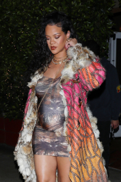 Santa Monica, CA  - *EXCLUSIVE*  - **WEB MUST CALL FOR PRICING** Rihanna flashes huge diamond on THAT finger as she heads to Giorgio Baldi for dinner! The superstar who is expecting her first child with boyfriend A$AP was seen  heading to dinner at  Giorgio Baldi restaurant  with friends in Santa Monica on Tuesday night. The 34-year-old singer is wearing a cat print skin-tight curvy dress, high heeled sandals  and a colorful fur-lined coat. What stood out the most was the huge rock on her left ring finger as she adjusted her necklace. The superstar as been seen wearing the sparkler before but has started now wearing it on the finger typically reserved for an engagement ring.  Pictured: Rihanna  BACKGRID USA 22 MARCH 2022  USA: +1 310 798 9111 / usasales@backgrid.com  UK: +44 208 344 2007 / uksales@backgrid.com  *UK Clients - Pictures Containing Children
Please Pixelate Face Prior To Publication*