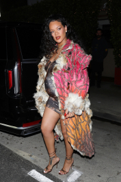 Santa Monica, CA  - *EXCLUSIVE*  - **WEB MUST CALL FOR PRICING** Rihanna flashes huge diamond on THAT finger as she heads to Giorgio Baldi for dinner! The superstar who is expecting her first child with boyfriend A$AP was seen  heading to dinner at  Giorgio Baldi restaurant  with friends in Santa Monica on Tuesday night. The 34-year-old singer is wearing a cat print skin-tight curvy dress, high heeled sandals  and a colorful fur-lined coat. What stood out the most was the huge rock on her left ring finger as she adjusted her necklace. The superstar as been seen wearing the sparkler before but has started now wearing it on the finger typically reserved for an engagement ring.  Pictured: Rihanna  BACKGRID USA 22 MARCH 2022  USA: +1 310 798 9111 / usasales@backgrid.com  UK: +44 208 344 2007 / uksales@backgrid.com  *UK Clients - Pictures Containing Children
Please Pixelate Face Prior To Publication*