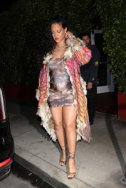 Santa Monica, CA  - *EXCLUSIVE*  - **WEB MUST CALL FOR PRICING** Rihanna flashes huge diamond on THAT finger as she heads to Giorgio Baldi for dinner! The superstar who is expecting her first child with boyfriend A$AP was seen  heading to dinner at  Giorgio Baldi restaurant  with friends in Santa Monica on Tuesday night. The 34-year-old singer is wearing a cat print skin-tight curvy dress, high heeled sandals  and a colorful fur-lined coat. What stood out the most was the huge rock on her left ring finger as she adjusted her necklace. The superstar as been seen wearing the sparkler before but has started now wearing it on the finger typically reserved for an engagement ring. Shot on 03/22/22.  Pictured: Rihanna  BACKGRID USA 23 MARCH 2022  USA: +1 310 798 9111 / usasales@backgrid.com  UK: +44 208 344 2007 / uksales@backgrid.com  *UK Clients - Pictures Containing Children
Please Pixelate Face Prior To Publication*