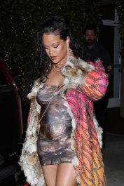 Santa Monica, CA  - *EXCLUSIVE*  - **WEB MUST CALL FOR PRICING** Rihanna flashes huge diamond on THAT finger as she heads to Giorgio Baldi for dinner! The superstar who is expecting her first child with boyfriend A$AP was seen  heading to dinner at  Giorgio Baldi restaurant  with friends in Santa Monica on Tuesday night. The 34-year-old singer is wearing a cat print skin-tight curvy dress, high heeled sandals  and a colorful fur-lined coat. What stood out the most was the huge rock on her left ring finger as she adjusted her necklace. The superstar as been seen wearing the sparkler before but has started now wearing it on the finger typically reserved for an engagement ring. Shot on 03/22/22.  Pictured: Rihanna  BACKGRID USA 23 MARCH 2022  USA: +1 310 798 9111 / usasales@backgrid.com  UK: +44 208 344 2007 / uksales@backgrid.com  *UK Clients - Pictures Containing Children
Please Pixelate Face Prior To Publication*