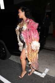 Santa Monica, CA  - *EXCLUSIVE*  - **WEB MUST CALL FOR PRICING** Rihanna flashes huge diamond on THAT finger as she heads to Giorgio Baldi for dinner! The superstar who is expecting her first child with boyfriend A$AP was seen  heading to dinner at  Giorgio Baldi restaurant  with friends in Santa Monica on Tuesday night. The 34-year-old singer is wearing a cat print skin-tight curvy dress, high heeled sandals  and a colorful fur-lined coat. What stood out the most was the huge rock on her left ring finger as she adjusted her necklace. The superstar as been seen wearing the sparkler before but has started now wearing it on the finger typically reserved for an engagement ring. Shot on 03/22/22.  Pictured: Rihanna  BACKGRID USA 23 MARCH 2022  USA: +1 310 798 9111 / usasales@backgrid.com  UK: +44 208 344 2007 / uksales@backgrid.com  *UK Clients - Pictures Containing Children
Please Pixelate Face Prior To Publication*