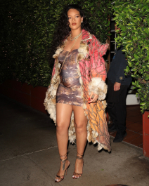 Santa Monica, CA  - *EXCLUSIVE*  - **WEB MUST CALL FOR PRICING**  Rihanna flashes huge diamond on THAT finger as she heads to Giorgio Baldi for dinner! The superstar who is expecting her first child with boyfriend A$AP was seen  heading to dinner at  Giorgio Baldi restaurant  with friends in Santa Monica on Tuesday night. The 34-year-old singer is wearing a cat print skin-tight curvy dress, high heeled sandals  and a colorful fur-lined coat. What stood out the most was the huge rock on her left ring finger as she adjusted her necklace. The superstar as been seen wearing the sparkler before but has started now wearing it on the finger typically reserved for an engagement ring. Shot on 03/22/22.  Pictured: Rihanna  BACKGRID USA 23 MARCH 2022  USA: +1 310 798 9111 / usasales@backgrid.com  UK: +44 208 344 2007 / uksales@backgrid.com  *UK Clients - Pictures Containing Children
Please Pixelate Face Prior To Publication*