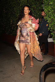 Santa Monica, CA  - *EXCLUSIVE*  - **WEB MUST CALL FOR PRICING**  Rihanna flashes huge diamond on THAT finger as she heads to Giorgio Baldi for dinner! The superstar who is expecting her first child with boyfriend A$AP was seen  heading to dinner at  Giorgio Baldi restaurant  with friends in Santa Monica on Tuesday night. The 34-year-old singer is wearing a cat print skin-tight curvy dress, high heeled sandals  and a colorful fur-lined coat. What stood out the most was the huge rock on her left ring finger as she adjusted her necklace. The superstar as been seen wearing the sparkler before but has started now wearing it on the finger typically reserved for an engagement ring. Shot on 03/22/22.  Pictured: Rihanna  BACKGRID USA 23 MARCH 2022  USA: +1 310 798 9111 / usasales@backgrid.com  UK: +44 208 344 2007 / uksales@backgrid.com  *UK Clients - Pictures Containing Children
Please Pixelate Face Prior To Publication*