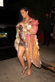 Santa Monica, CA  - *EXCLUSIVE*  - **WEB MUST CALL FOR PRICING**  Rihanna flashes huge diamond on THAT finger as she heads to Giorgio Baldi for dinner! The superstar who is expecting her first child with boyfriend A$AP was seen  heading to dinner at  Giorgio Baldi restaurant  with friends in Santa Monica on Tuesday night. The 34-year-old singer is wearing a cat print skin-tight curvy dress, high heeled sandals  and a colorful fur-lined coat. What stood out the most was the huge rock on her left ring finger as she adjusted her necklace. The superstar as been seen wearing the sparkler before but has started now wearing it on the finger typically reserved for an engagement ring. Shot on 03/22/22.  Pictured: Rihanna  BACKGRID USA 23 MARCH 2022  USA: +1 310 798 9111 / usasales@backgrid.com  UK: +44 208 344 2007 / uksales@backgrid.com  *UK Clients - Pictures Containing Children
Please Pixelate Face Prior To Publication*