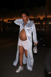 BGUK_2353724 - Los Angeles, CA  - Rihanna's growing baby bump plays peek-a-boo while stepping out for dinner in Los Angeles. The mother-to-be kept it simple yet chic in an open long silk blouse paired with shorts and sneakers.  Pictured: Rihanna  BACKGRID UK 9 APRIL 2022  BYLINE MUST READ: iamKevinWong.com / BACKGRID  UK: +44 208 344 2007 / uksales@backgrid.com  USA: +1 310 798 9111 / usasales@backgrid.com  *UK Clients - Pictures Containing Children
Please Pixelate Face Prior To Publication*