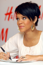 NEW YORK - JANUARY 31:  Singer Rihanna signs autographs at H&M for the launch of Fashion Against AIDS Collection on January 31, 2008 in New York City.  (Photo by Rob Loud/Getty Images)