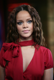 NEW YORK - APRIL 25:  (U.S. TABS OUT)  Rihanna appears onstage during MTV's Total Request Live at the MTV Times Square Studios on April 25, 2006 in New York City.  (Photo by Scott Gries/Getty Images)