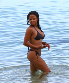 Miami, FL  - Christina Milian spends time with her family at the beach. The singer takes a dip in the water sporting a small black bikini.  Pictured: Christina Milian  BACKGRID USA 18 JULY 2017  BYLINE MUST READ: VEM / BACKGRID  USA: +1 310 798 9111 / usasales@backgrid.com  UK: +44 208 344 2007 / uksales@backgrid.com  *UK Clients - Pictures Containing Children
Please Pixelate Face Prior To Publication*