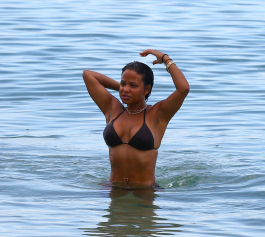 Miami, FL  - Christina Milian spends time with her family at the beach. The singer takes a dip in the water sporting a small black bikini.  Pictured: Christina Milian  BACKGRID USA 18 JULY 2017  BYLINE MUST READ: VEM / BACKGRID  USA: +1 310 798 9111 / usasales@backgrid.com  UK: +44 208 344 2007 / uksales@backgrid.com  *UK Clients - Pictures Containing Children
Please Pixelate Face Prior To Publication*