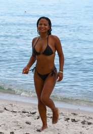 Miami, FL  - Christina Milian spends time with her family at the beach. The singer takes a dip in the water sporting a small black bikini.  Pictured: Christina Milian  BACKGRID USA 18 JULY 2017  BYLINE MUST READ: VEM / BACKGRID  USA: +1 310 798 9111 / usasales@backgrid.com  UK: +44 208 344 2007 / uksales@backgrid.com  *UK Clients - Pictures Containing Children
Please Pixelate Face Prior To Publication*