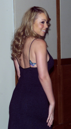 Mariah Carey, with a butterfly tattoo on her back,  arrives at the Fresh Air Funds 17th Annual Fall Frolic and Auction in New York City on November 15, 2001.  photo by Gabe Palacio/ImageDirect