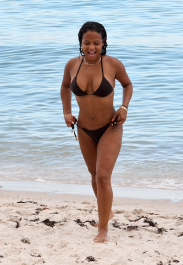 , Miami, FL - 7/18/2017 - Christina Milian laughs off a wardrobe malfunction as she exposes her nipple ring while trying to take the perfect bikini selfie in the ocean in Miami. The singer was wearing a black string bikini that showed off her curves while relaxing with family on the beach.  -PICTURED: Christina Milian
-PHOTO by: INSTARimages.com
-Instar_Christina_Milian_Accidentally_10011211764  Editorial Rights Managed Image - Please contact www.INSTARimages.com for licensing fee and rights: North America Inquiries: email sales@instarimages.com or call 212.414.0207 - UK Inquiries: email ben@instarimages.com or call + 7715 698 715 - Australia Inquiries: email sarah@instarimages.com.au Êor call +02 9660 0500 Ð for any other Country, please email sales@instarimages.com. ÊImage or video may not be published in any way that is or might be deemed defamatory, libelous, pornographic, or obscene / Please consult our sales department for any clarification or question you may have - http://www.INSTARimages.com reserves the right to pursue unauthorized users of this image or video. If you are in violation of our intellectual property you may be liable for actual damages, loss of income, and profits you derive from the use of this image or video, and where appropriate, the cost of collection and/or statutory damage.