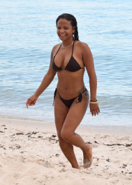 , Miami, FL - 7/18/2017 - Christina Milian laughs off a wardrobe malfunction as she exposes her nipple ring while trying to take the perfect bikini selfie in the ocean in Miami. The singer was wearing a black string bikini that showed off her curves while relaxing with family on the beach.  -PICTURED: Christina Milian
-PHOTO by: INSTARimages.com
-Instar_Christina_Milian_Accidentally_10011211773  Editorial Rights Managed Image - Please contact www.INSTARimages.com for licensing fee and rights: North America Inquiries: email sales@instarimages.com or call 212.414.0207 - UK Inquiries: email ben@instarimages.com or call + 7715 698 715 - Australia Inquiries: email sarah@instarimages.com.au Êor call +02 9660 0500 Ð for any other Country, please email sales@instarimages.com. ÊImage or video may not be published in any way that is or might be deemed defamatory, libelous, pornographic, or obscene / Please consult our sales department for any clarification or question you may have - http://www.INSTARimages.com reserves the right to pursue unauthorized users of this image or video. If you are in violation of our intellectual property you may be liable for actual damages, loss of income, and profits you derive from the use of this image or video, and where appropriate, the cost of collection and/or statutory damage.