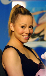 392208 01: Singer Mariah Carey poses for photographers at The Wall music store where she signed autographs for fans July 20, 2001 in Mineola, New York. (Photo by Mario Tama/Getty Images)