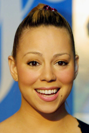 392208 03: Singer Mariah Carey poses for photographers at The Wall music store where she signed autographs for fans July 20, 2001 in Mineola, New York. (Photo by Mario Tama/Getty Images)